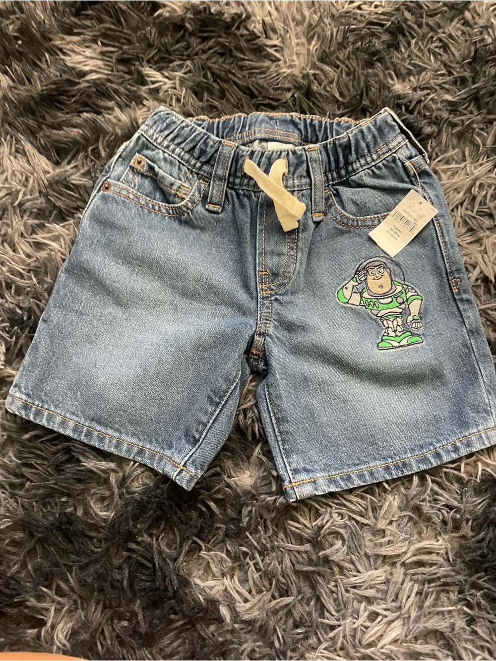 Disney Blue Denim Shorts with Green Buzz Lightyear Patch